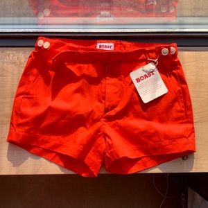 BOAST bright orange tennis shorts. NWT